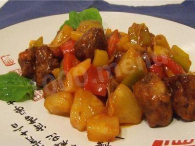 Pork in sweet and sour sauce with pineapples