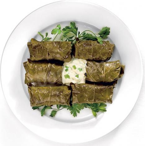 Cabbage rolls made of grape leaves in Hebrew