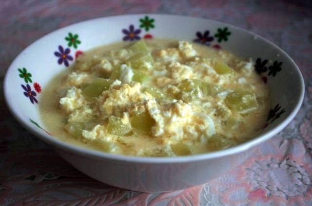 Stewed zucchini in sour cream with egg