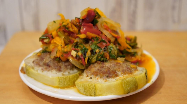 Zucchini stuffed in Mediterranean style with vegetable sauce
