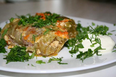 Cabbage rolls from young cabbage with meat in the oven are classic