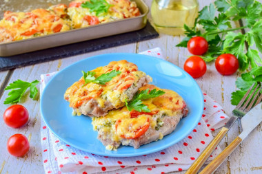 Pork in the oven with cheese and tomatoes