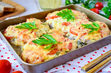 Pork in the oven with cheese and tomatoes