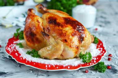 Crispy chicken baked whole in the oven with salt