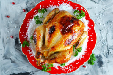 Crispy chicken baked whole in the oven with salt