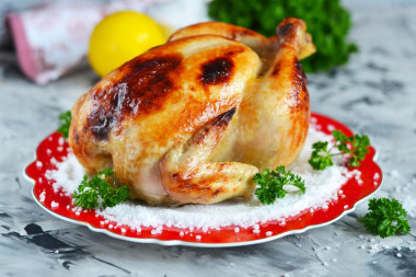 Crispy chicken baked whole in the oven with salt