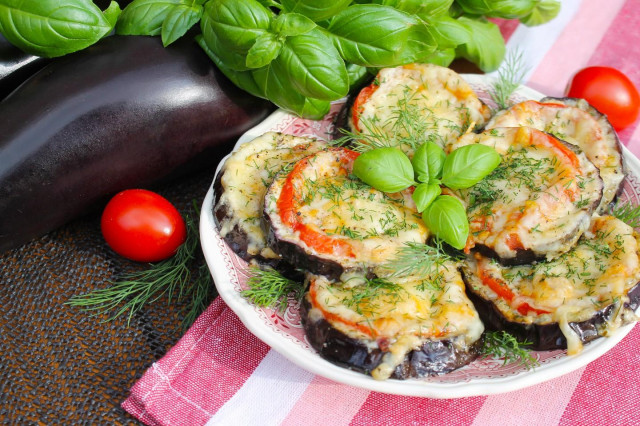Eggplant with tomatoes cheese and garlic in the oven circles