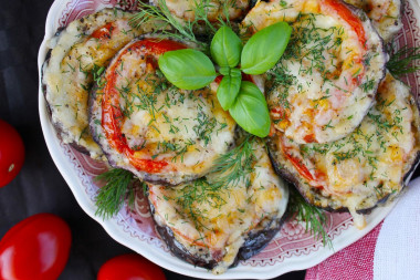 Eggplant with tomatoes cheese and garlic in the oven circles
