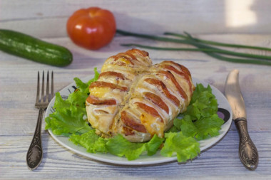 Chicken breasts with tomatoes and cheese in oven