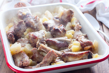 Pork ribs with potatoes in the oven