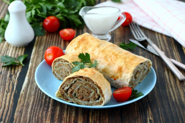 Pita bread roll with minced meat in the oven