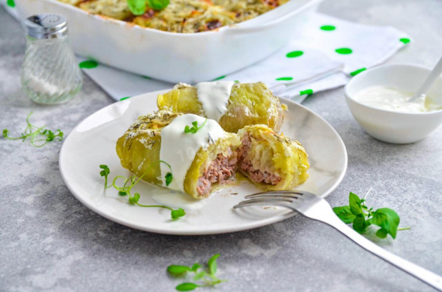 Cabbage rolls in sour cream sauce in the oven