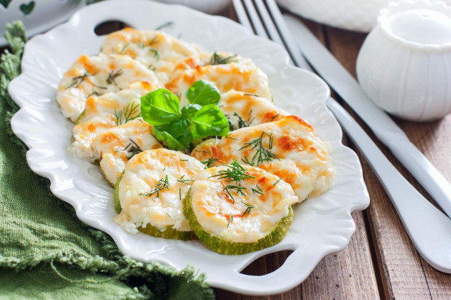 Zucchini baked with cheese in the oven