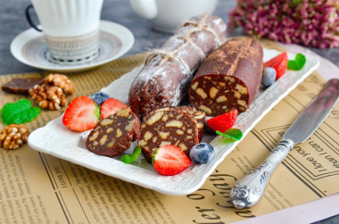 Chocolate sausage with condensed milk from cookies and nuts