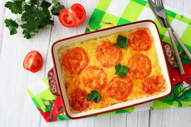 Casserole of zucchini and tomatoes with cheese in the oven