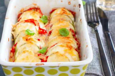 Zucchini baked with tomatoes and cheese in the oven