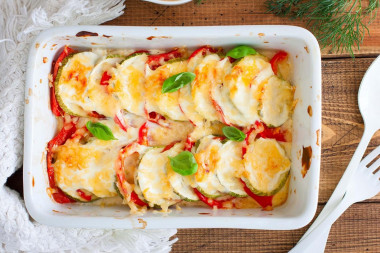 Zucchini baked with tomatoes and cheese in the oven