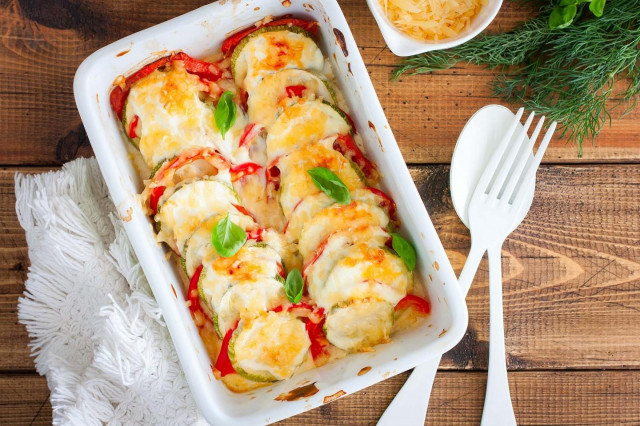 Zucchini baked with tomatoes and cheese in the oven