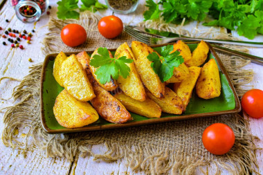 Baked potatoes with garlic in the oven