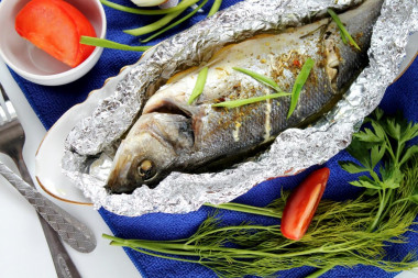 Whole fish baked in the oven in foil