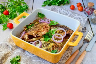 Baked crucian carp in sour cream in the oven