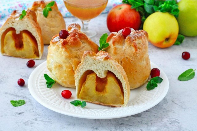 Apples baked in yeast dough in the oven