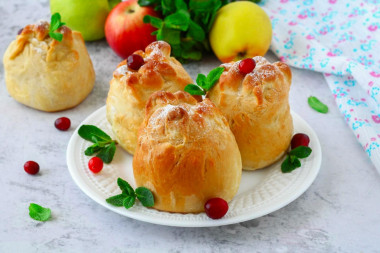 Apples baked in yeast dough in the oven