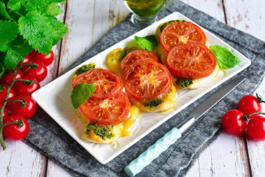 Chicken chop with tomato and cheese in the oven