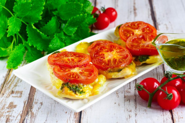 Chicken chop with tomato and cheese in the oven