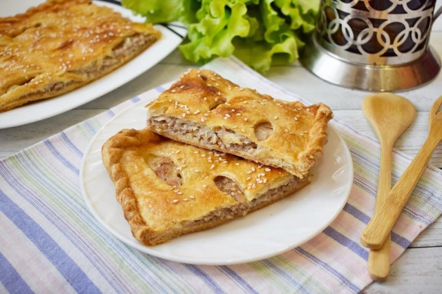 Puff pastry pie with minced meat in the oven