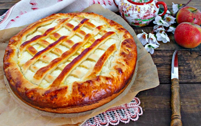 Yeast dough pie with cottage cheese in the oven