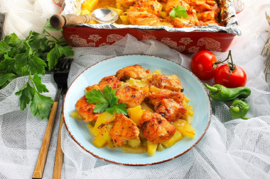 Chicken with potatoes in foil in the oven