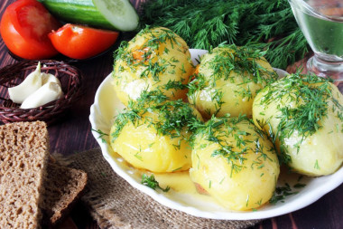 Baked potatoes in foil in the oven