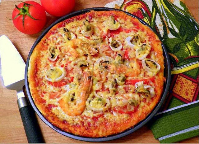 Homemade seafood pizza in the oven