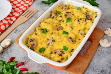 Potatoes with meat, mushrooms and cheese baked in the oven