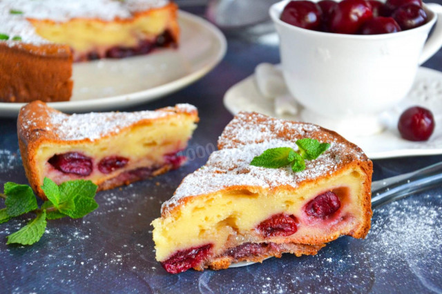 Aspic pie with cherries and sour cream in the oven