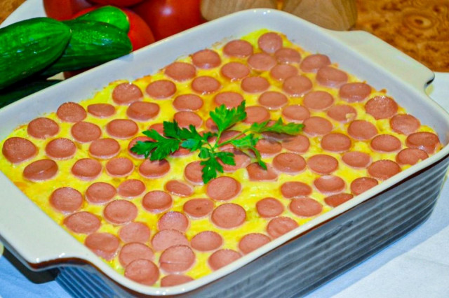 Potato casserole with sausages, cheese in the oven