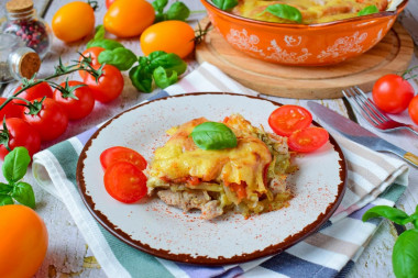 Pork meat under a potato coat with cheese in the oven