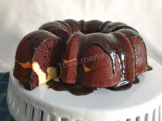 Chocolate cupcake with cocoa and cream cheese in the oven