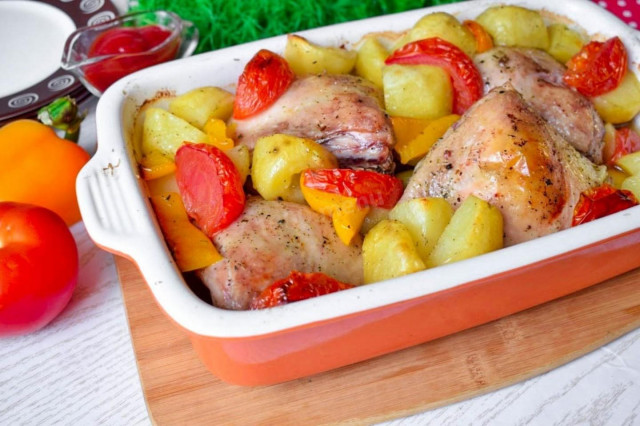 Chicken with potatoes and vegetables in the oven