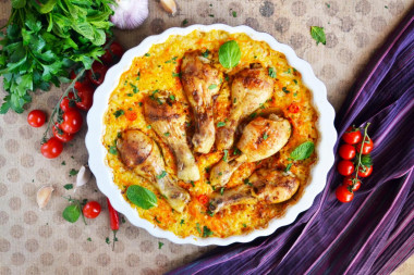 Chicken legs with rice baked in the oven