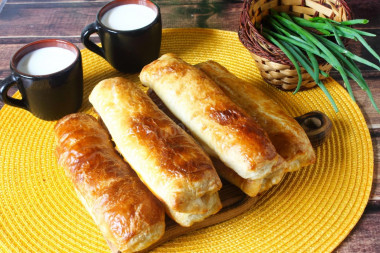 Puff pastry pies with meat in the oven