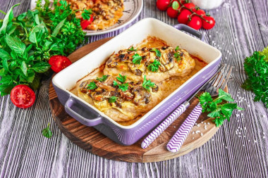 Chicken fillet with mushrooms and cheese in the oven