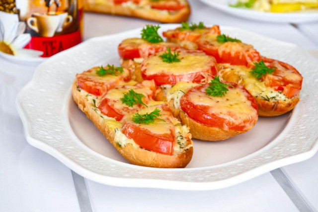 Sandwiches with tomatoes and cheese in the oven