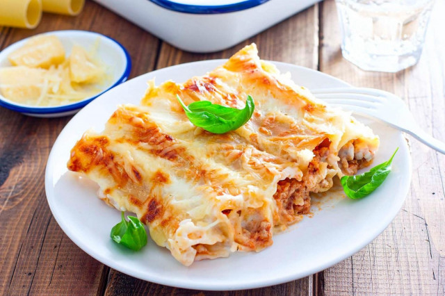Cannelloni with minced meat in oven