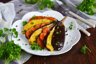 Eggplant fan in the oven with tomatoes and cheese