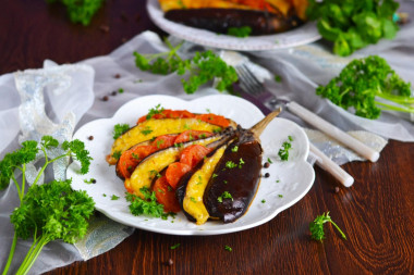 Eggplant fan in the oven with tomatoes and cheese