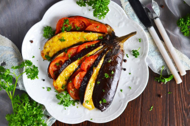 Eggplant fan in the oven with tomatoes and cheese