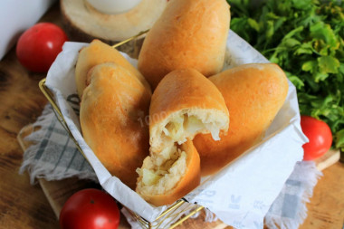 Baked pies in the oven with cabbage