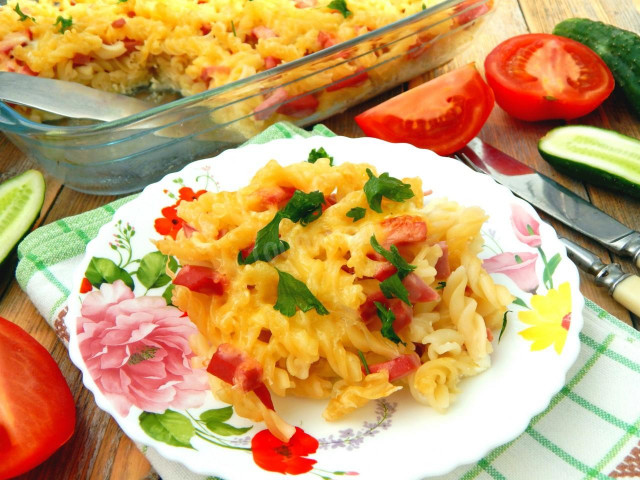 Pasta casserole with sausage and cheese in the oven